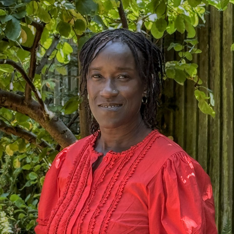 Veronica, cohost of Shabbat & Conversations at Echoed From Eden, smiling outdoors.